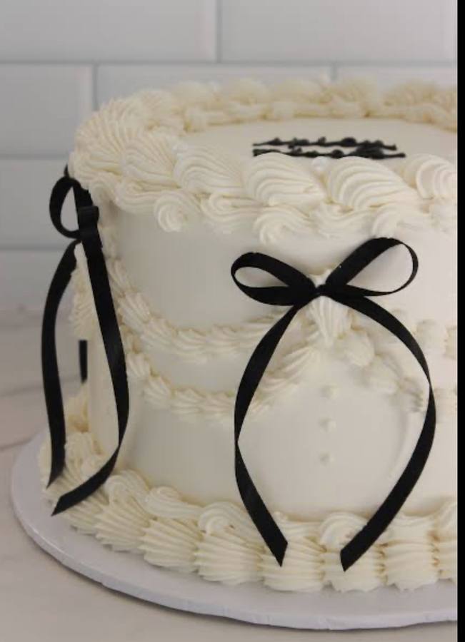 Signature ribbon bow cake — elegant white cake with black ribbon, Cake Letter's specialty