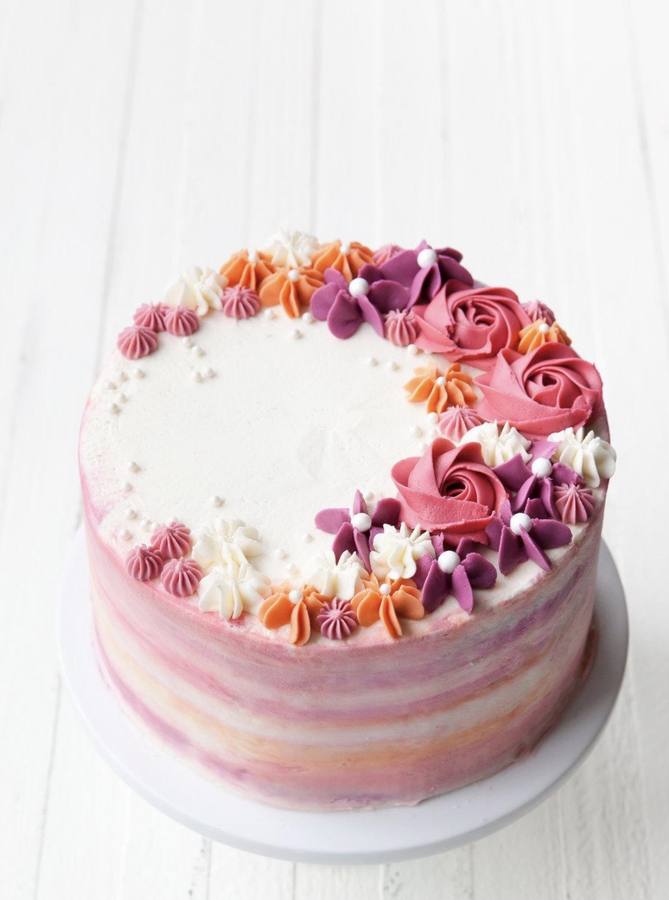 Floral layered cake with pink and purple buttercream flowers